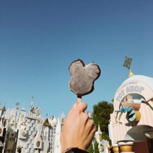 Enjoy a sunny day at Disneyland Anaheim with a tasty Mickey ice cream in hand.